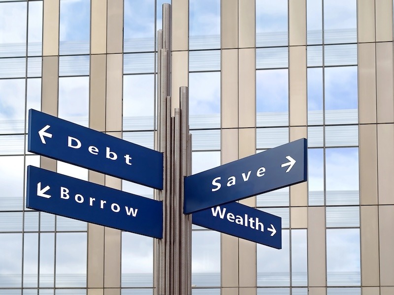 Image showing the intersection of many different financial goals depicted as street signs